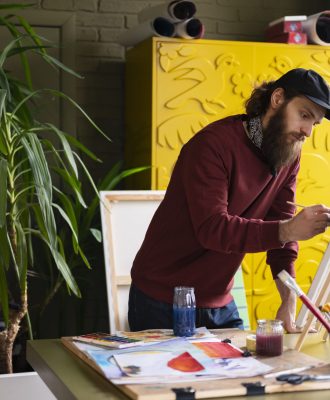 male-painter-using-watercolor-his-art-studio (1)